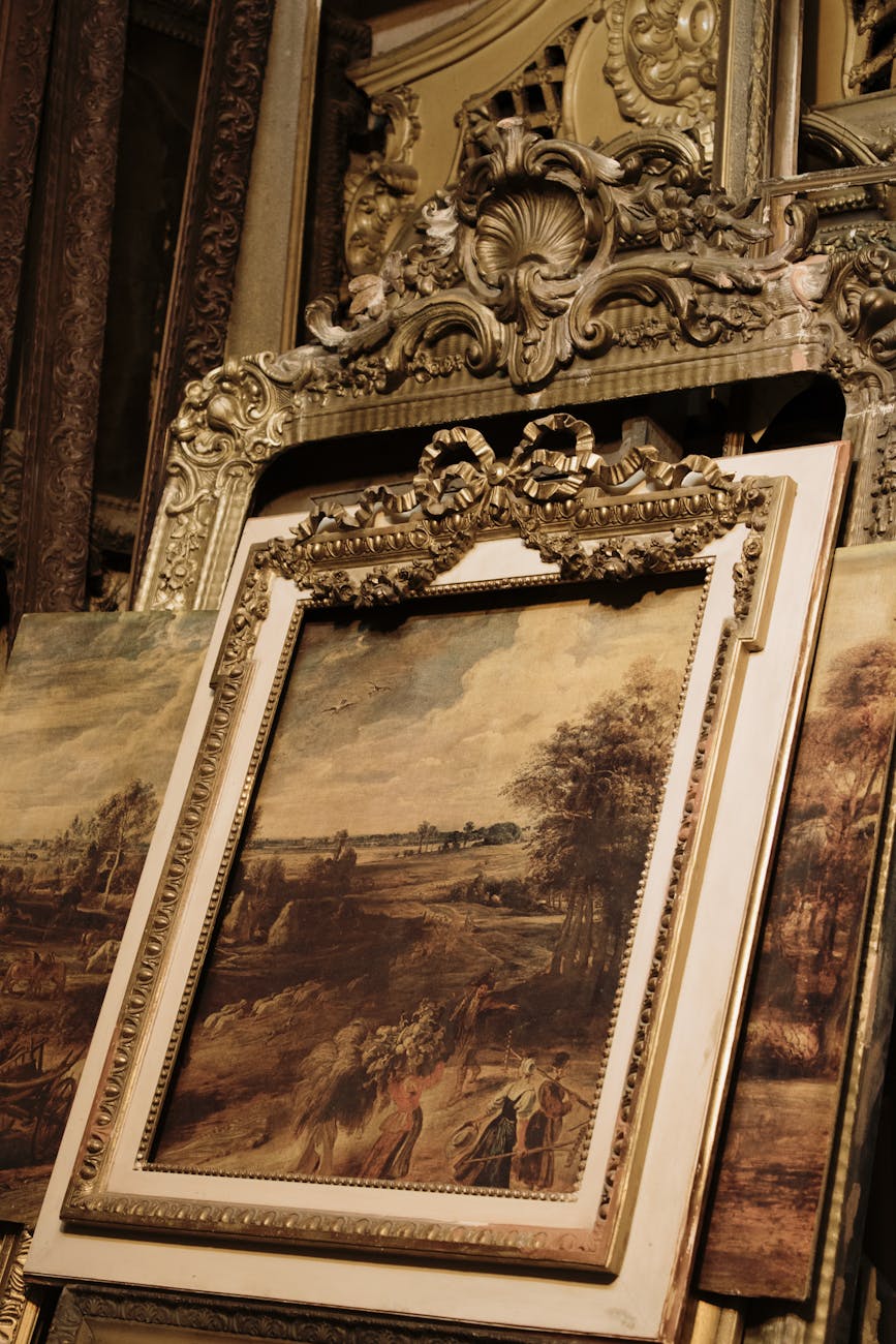 a brown wooden framed painting
